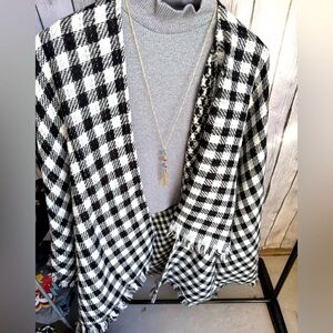 Black and white check poncho one size fits all. Brand new in Polly bag.